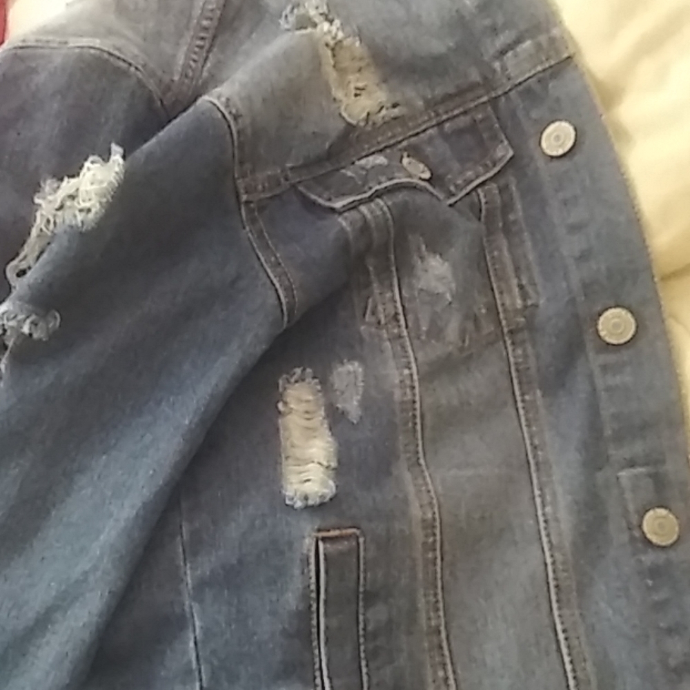 A light ripped denem jacket